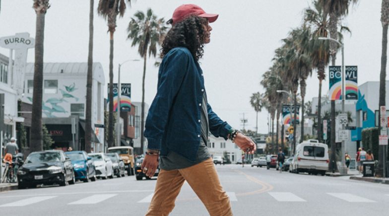 Lady walking down a street in California